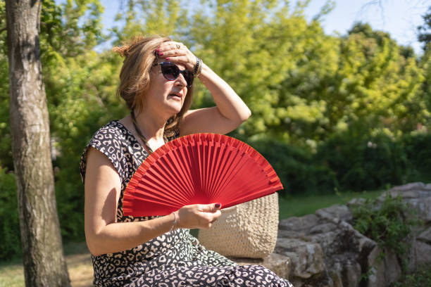 istock Mature Woman Experiencing Heatwave 1411930204