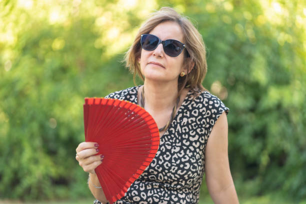 istock Mature Woman Experiencing Heatwave 1411930209