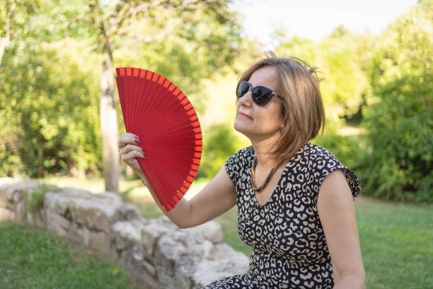 istock Mature Woman Experiencing Heatwave 1411930216