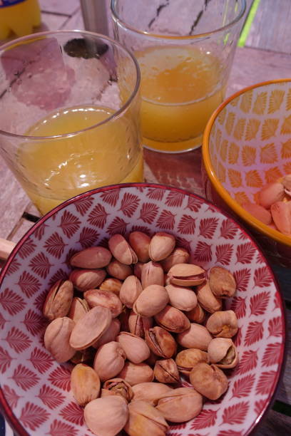 istock Orange soda in glasses served with pistachios as an appetizer 1411931280