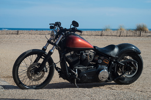 Leros Island, Greece – November 5, 2023: Harley-Davidson on the road and sunny background.