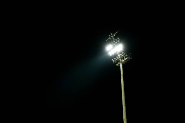 istock Photo shows stadium lights flashing in the dark. 1411931987