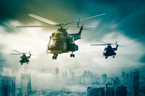 istock Three military helicopters flying over the misty city 1411933111