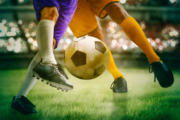 istock Two soccer players intense struggle for the ball 1411933124