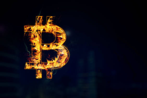 istock Burning bitcoin symbol in the dark room 1411933131