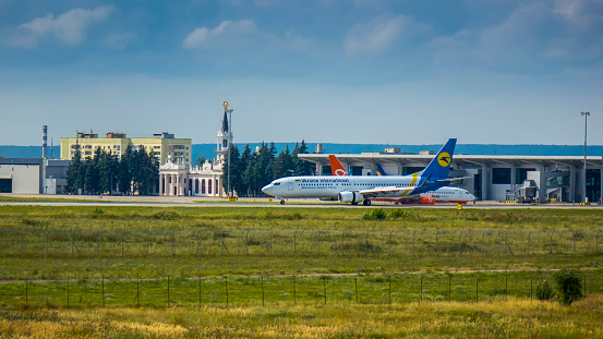 Ukraine , Kharkiv, June 31, 2022, Airport near the city, planes landing at Kharkiv airport, beautiful view of the lifting plane