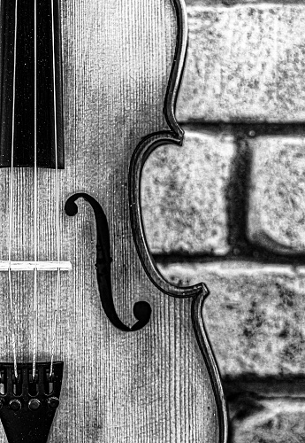 Violin against a brick wall