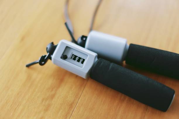 istock Jump rope with counter on wooden floor 1411945687