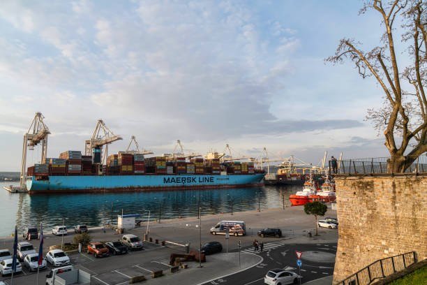 Koper harbor, Slovenia Koper, Slovenia - 15.04.2022: Huge cargo container ship in the industrial harbor of Koper, Slovenia koper slovenia stock pictures, royalty-free photos & images