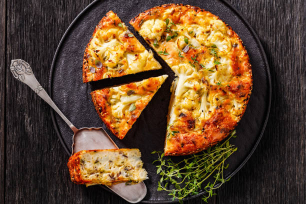 istock Cauliflower Cake with cheese, basil, top view 1411946853