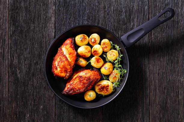 istock grilled chicken breasts with browned new potatoes 1411946985