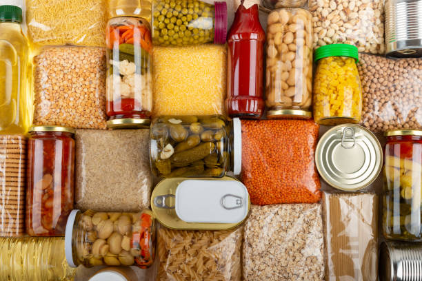 istock Emergency survival groceries on kitchen table closeup flat lay 1411948071