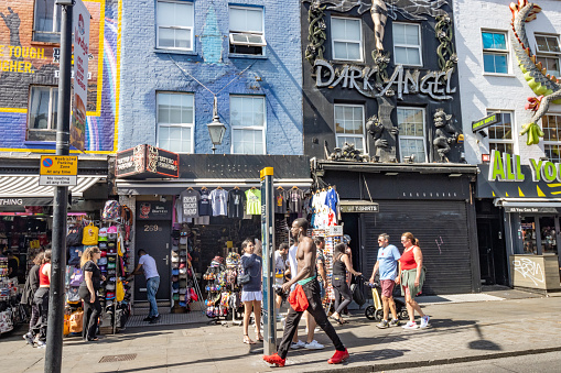 Dark Angel Tattoo & Piercing Parlor at Camden High Street, London, with people walking past