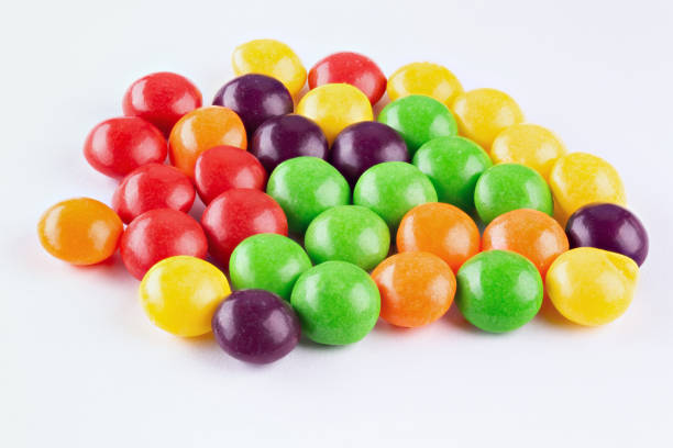 istock Chocolate coated Peanuts. Colorful chocolate buttons, on white background. 1411951450