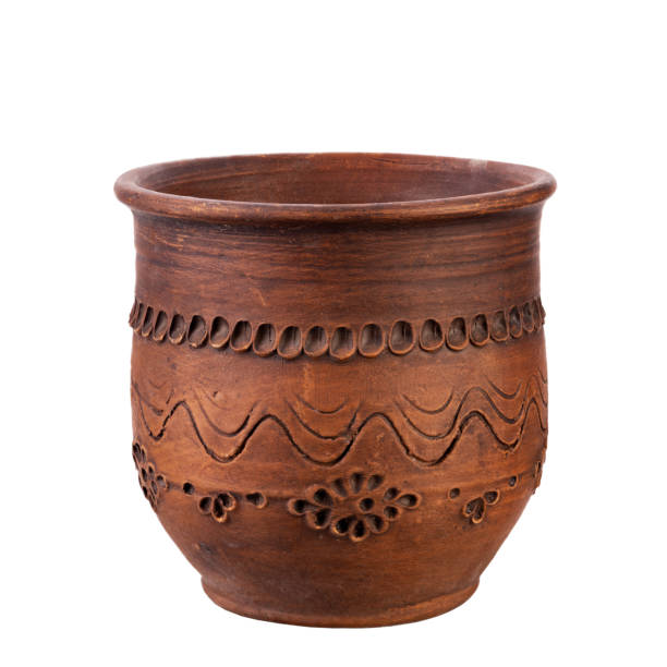 istock One empty clay cup for milk or tea, isolated on white background. Full depth of field. 1411951515