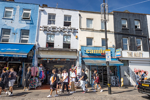 People walking near Rokit Vintage Clothing Store on Camden High Street in Borough of Camden, London