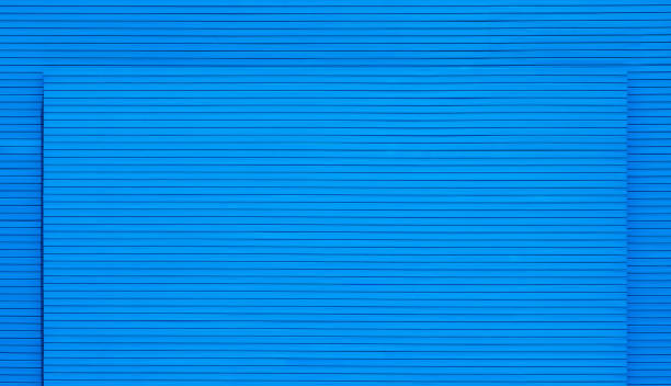 istock Blank blue wooden smart board exterior building wall in 2 different level decoration for outdoor advertising display presentation 1411953234