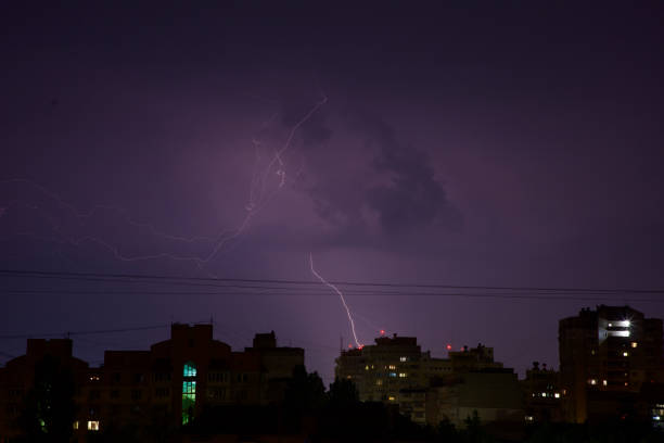 istock Lightning in the sky at night. Lightning during a thunderstorm in the night sky 1411953302