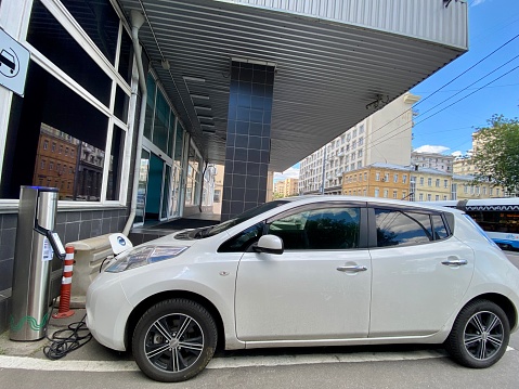 Moscow, Russia  - July 30, 2022: Electric Nissan charging on Moscow street