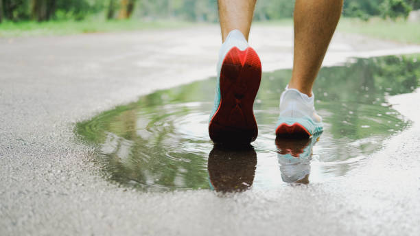 istock Walking alone  on the road. 1411955052