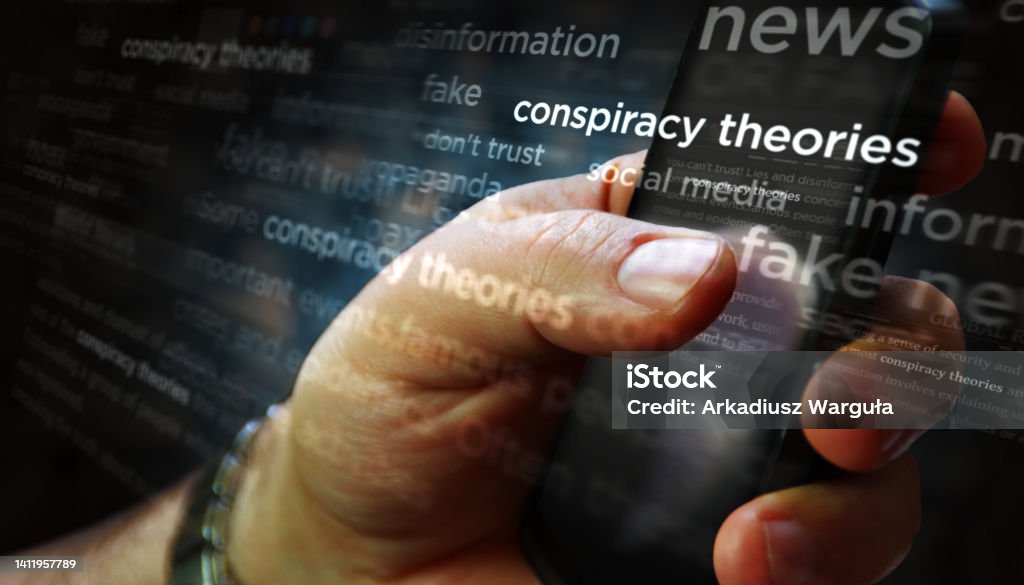 News titles on screen in hand with Conspiracy theories3d illustration Social media on display with Conspiracy theories, hoax theory and fake news. Searching on tablet, pad, phone or smartphone screen in hand. Abstract concept of news titles 3d illustration. Conspiracy Stock Photo