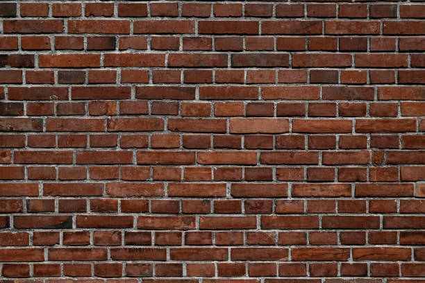 istock view of red brick wall. Abstract background texture. Seamless pattern. Wallpaper 1411961453