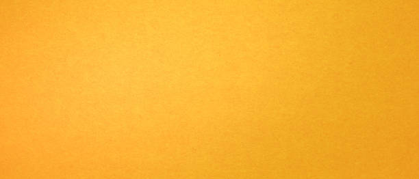 istock luxury grunge bright yellow recycled paper texture background, top view 1411962894