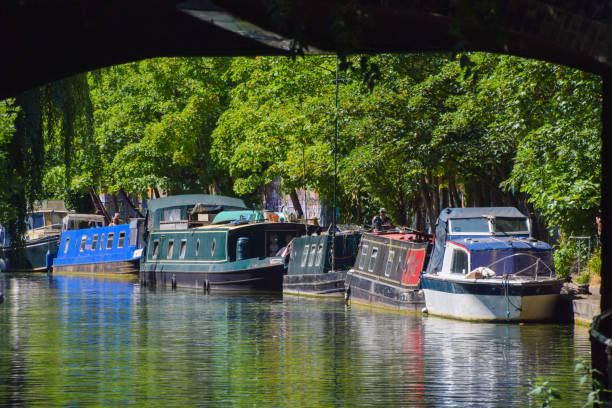 Houseboats on Regent's Canal in Camden, London, UK London, United Kingdom - July 16 2022: houseboats on Regent's Canal in Camden camden lock stock pictures, royalty-free photos & images