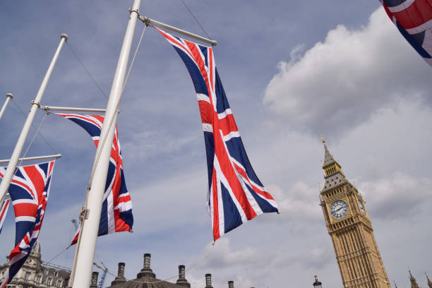 London, UK, May 9 2022: Union Jack flags in Parliament Square and Big Ben