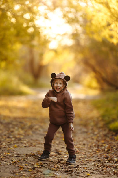 istock Girl with a maple leaf in her hands 1411965830