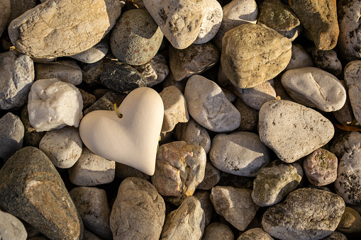 Love is everywhere, Love in nature, stone heart on among the stones