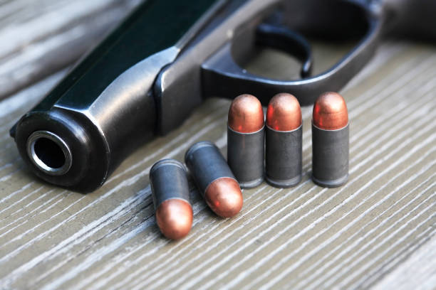 istock Bullets Near Handgun 1411971451