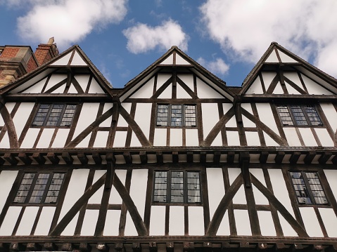 exterior low viewpoint view of the black and white half-timbered Leigh-Pemberton House which stands on the corner of Castle Square and Bailgate in Lincoln. It was built around 1543 as a wealthy merchant's house