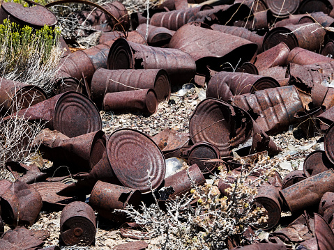 Rusted old cans in the desert
