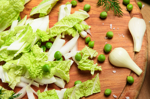 Fresh various vegetables on a wooden table background, with a space for headline copy