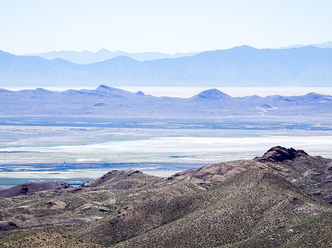 Looking down on hazy desert valleys and distant mountain ranges in Nevada.