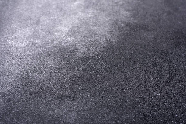 istock Texture of a concrete wall with cracks and scratches which can be used as a background 1411984200