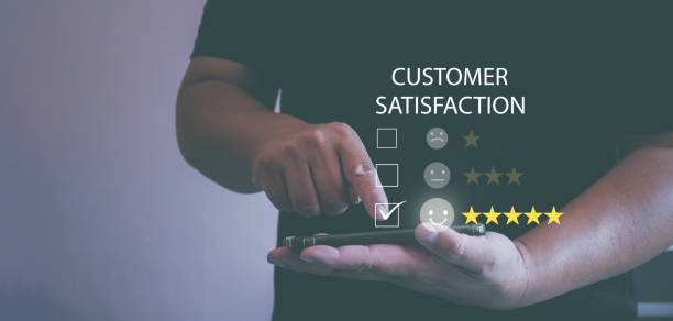 istock Customer Service Assessment Concept.Users rate the service of an online application. Businessman presses smiley face showing emoticon on virtual screen, survey, user experience questionnaire or customer satisfaction research. 1411987894