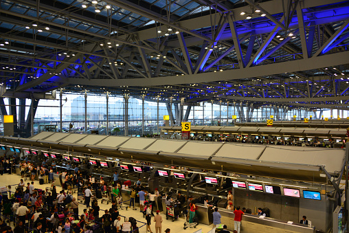Bangkok, Thailand: Bangkok Airport / Suvarnabhumi Airport - Check in desks - view from above with Zone S in the foreground - roof trellis structure, super-truss girders.