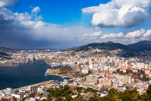 Nagasaki, Japan downtown cityscape over the bay in the afternoon.