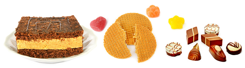 Cake ,chocolate candies and waffles isolated on white background. Collage. Wide photo.