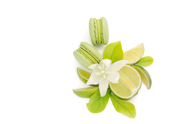 istock Citrus lime and green macarons on a white background. 1411999891