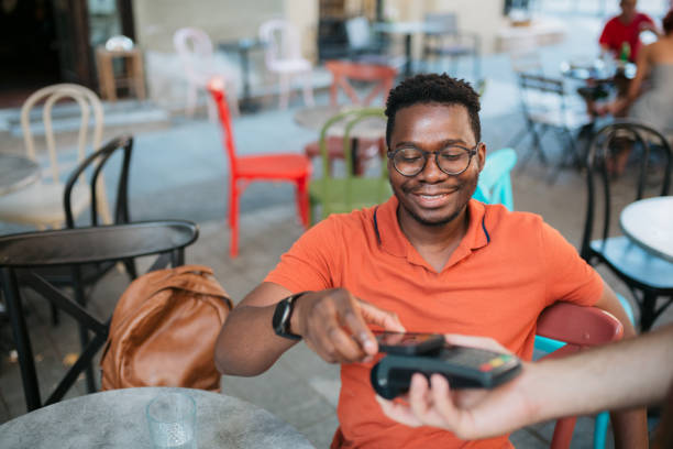 istock Paying electronically in a coffee shop 1412000786
