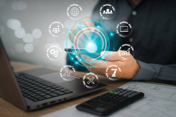 istock Digital transformation technology, Business man use smartphone and laptop control over the Internet with industry work with icon flow automation and data exchange in manufacturing technologies. 1412000820