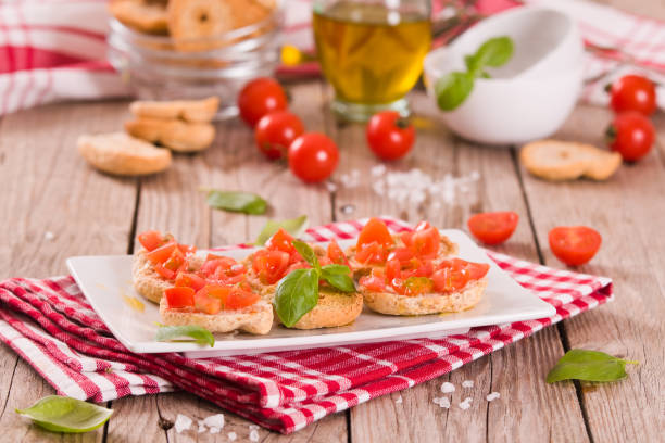 istock Friselle with cherry tomatoes and basil. 1412001197