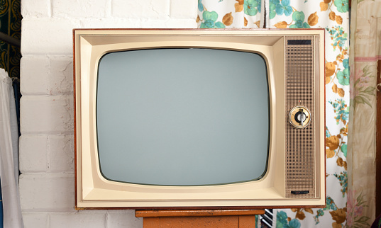 Retro old television with clipping path isolated on white background. TV standing and blank screen, antique, technology