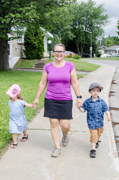 istock Family walking on the sidewalk 1412003835