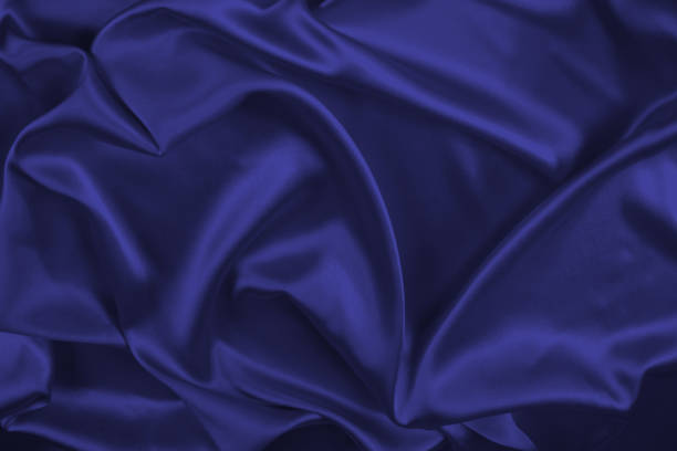 istock Red silk or satin luxury fabric texture can use as abstract background. Top view. 1412004826