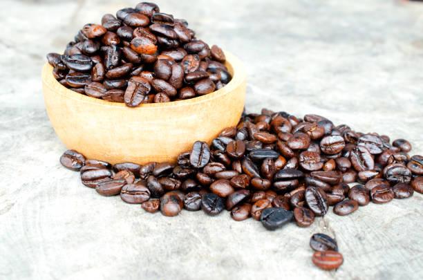 istock Roasted coffee bean in wooden bowl backgrounds 1412005060