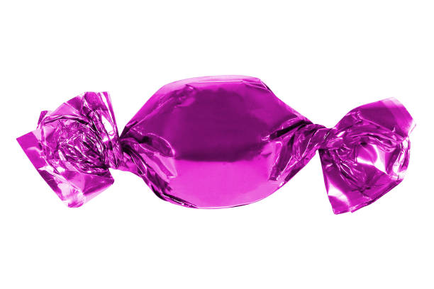 istock Candy in pink foil isolated. C 1412005419